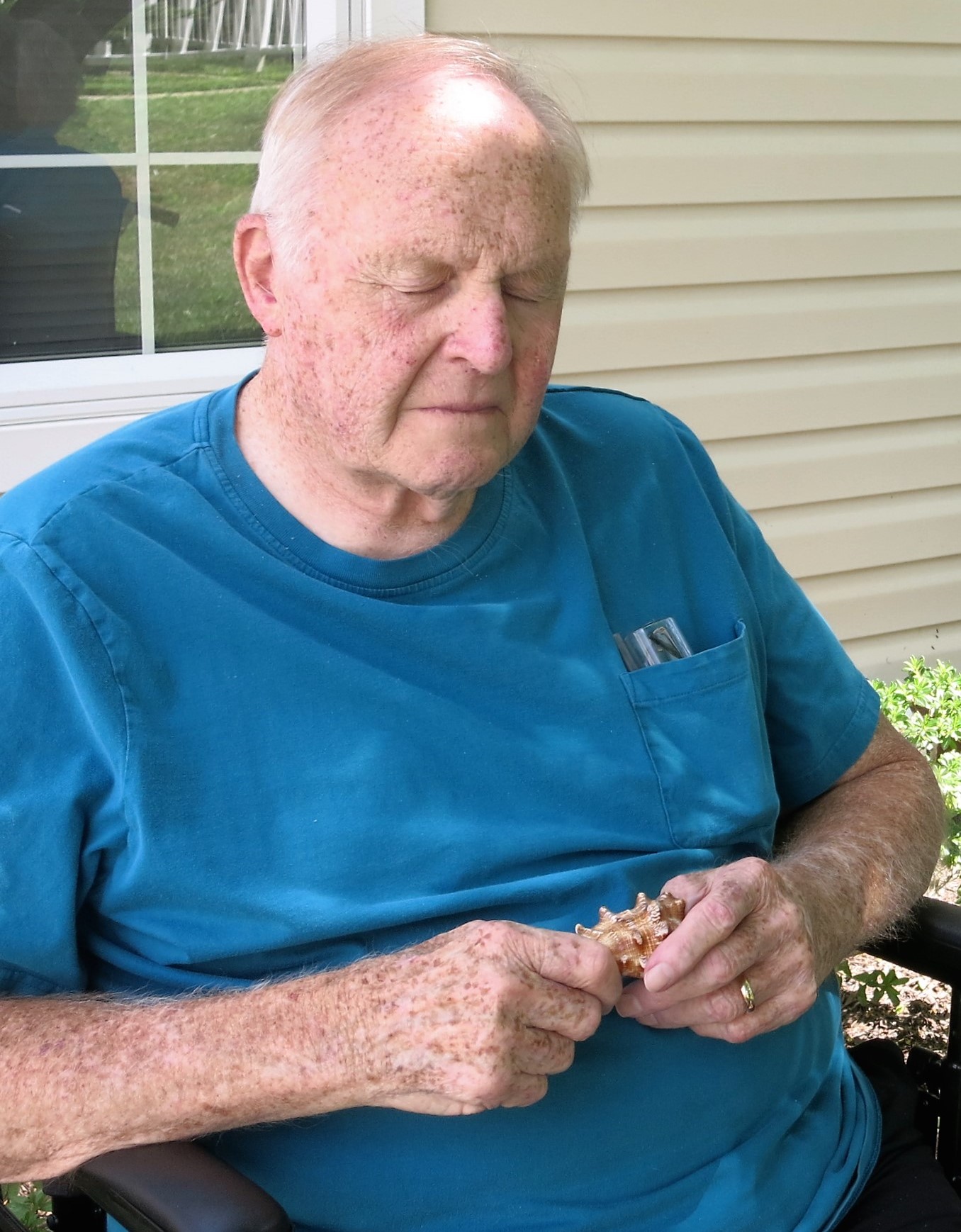 resident holding seashell for meditation