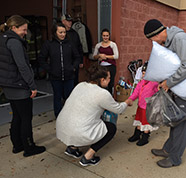 child shaking hands at donation drive thumbnail