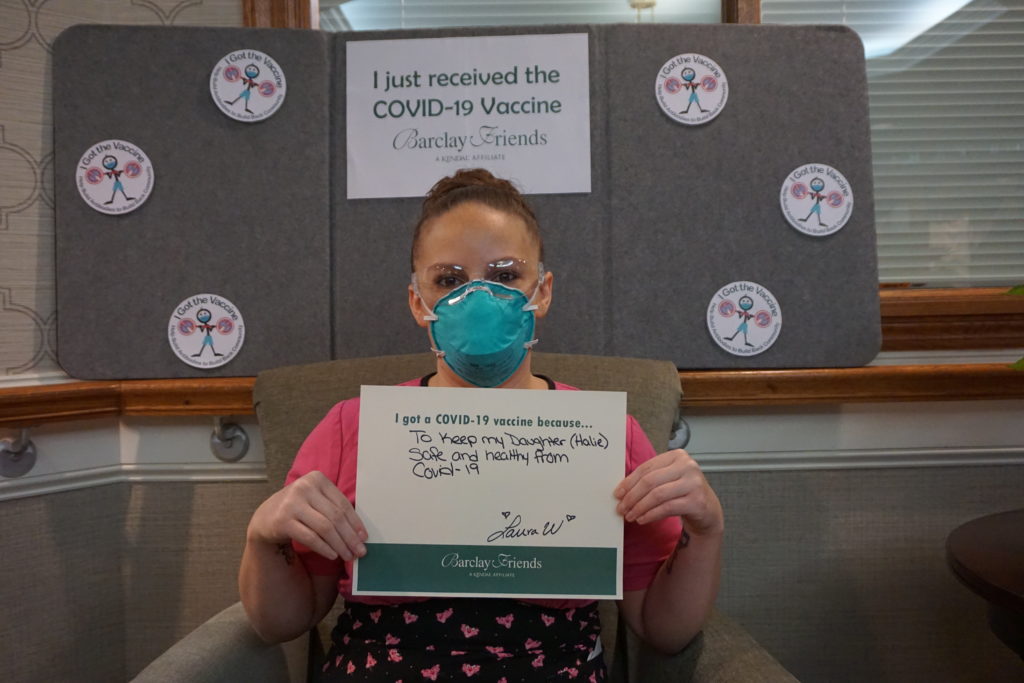 Barclay Friends Employee with vaccine sign
