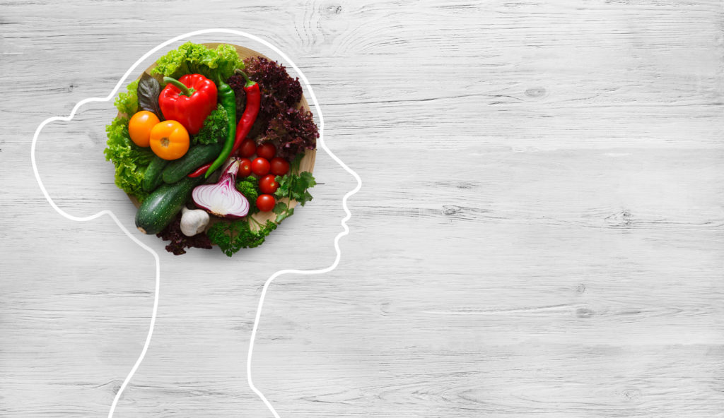 sketch of woman with vegetables on brain
