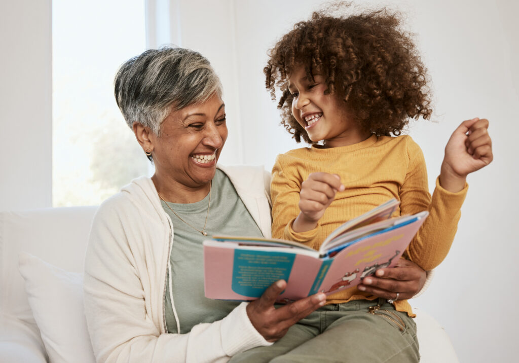 Senior grandmother telling exciting story to  granddaughter