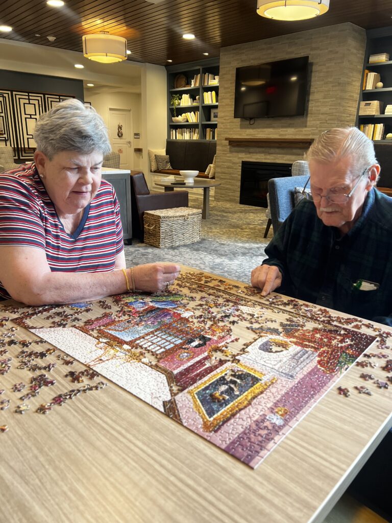 seniors playing with puzzle