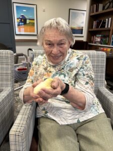senior holding chick