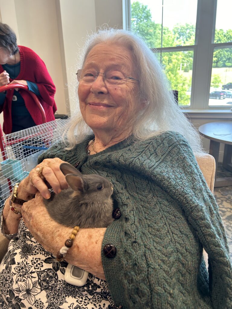 senior holding bunny