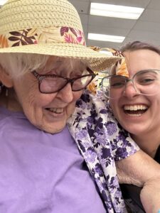 senior laughing with young adult